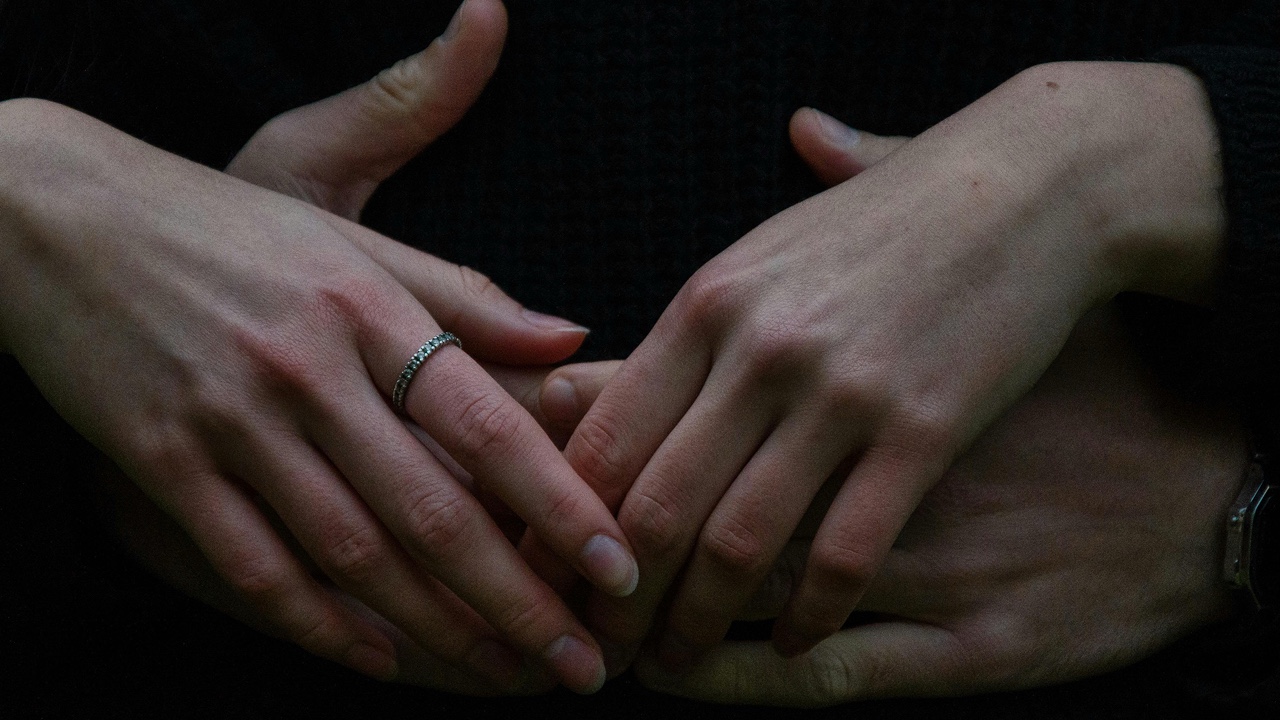 Couples hands intertwined